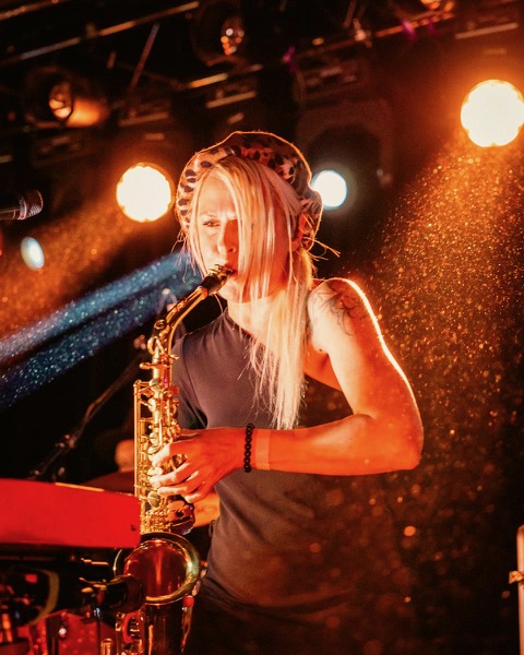 Isabel Paradis with the sax. Photo © Alex Henry Foster Band